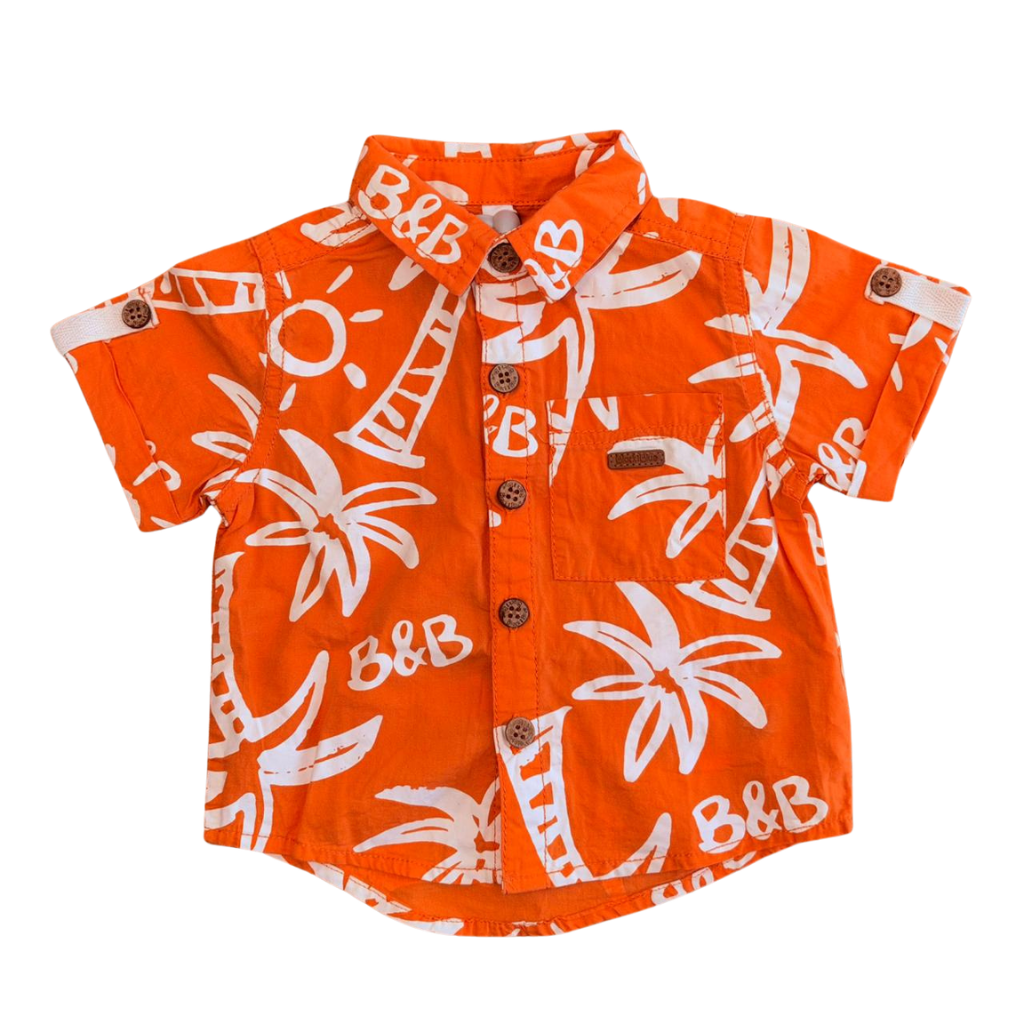 Camisa manga corta naranja con diseño de palmeras blancas