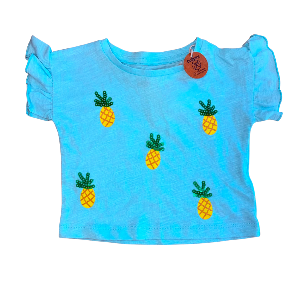 Polera etiqueta verde pastel con estampado de piña