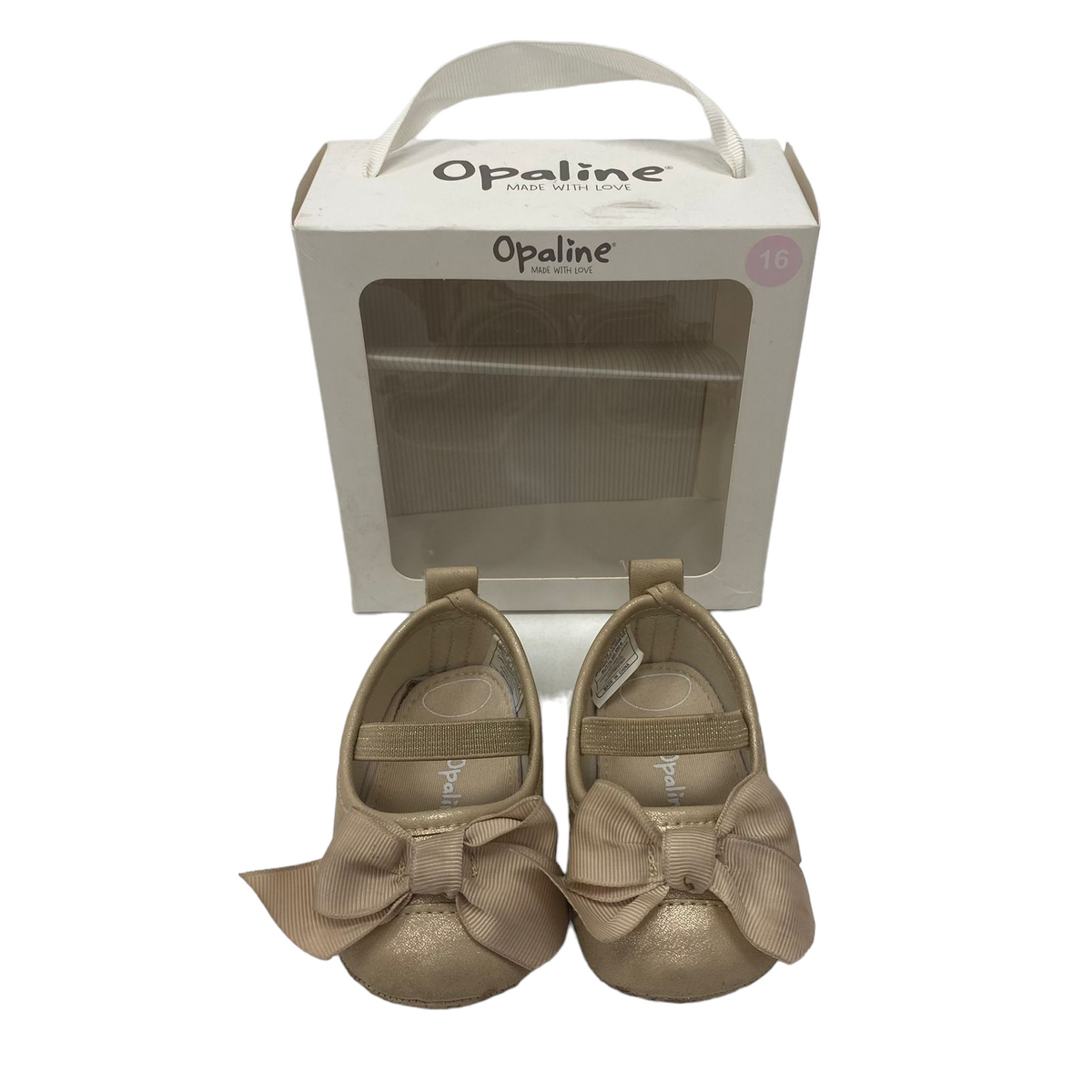 Zapatillas doradas con lazitos en su caja Opiline